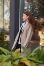 outdoors portrait of young caucasian red headed girl in coat with long hair Royalty Free Stock Photo