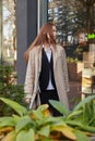 outdoors portrait of young caucasian red headed girl in coat with long hair Royalty Free Stock Photo