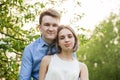 Outdoors portrait of young couple. Girl and boy together against green nature background Royalty Free Stock Photo