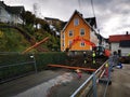 Outdoors road work with a Hitachi excavator and plumbers in Samnanger, Norway