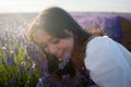 Outdoors romantic portrait of young happy and attractive woman in white summer dress enjoying carefree at beautiful lavender Royalty Free Stock Photo