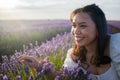 Outdoors romantic portrait of young happy and attractive woman in white summer dress enjoying carefree at beautiful lavender Royalty Free Stock Photo