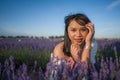 Outdoors romantic portrait of young happy and attractive woman in white summer dress enjoying carefree at beautiful lavender Royalty Free Stock Photo