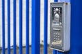 Intercom buzzer on a blue gate Royalty Free Stock Photo