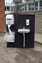 Outdoors sink with water tap, soap and paper near a school - used preventively to protect against the coronavirus COVID-19