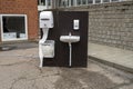 Outdoors sink with water tap, soap and paper near a school - used preventively to protect against the coronavirus COVID-19