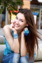 Outdoors street portrait of beautiful young brunette girl