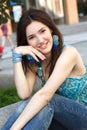 Outdoors street portrait of beautiful young brunette girl