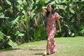 Outdoors Summer lifestyle portrait of young beautiful and happy Asian Korean woman in elegant dress walking tranquil and cheerful Royalty Free Stock Photo