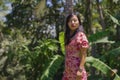 Outdoors Summer lifestyle portrait of young beautiful and happy Asian Korean woman in elegant dress walking tranquil and cheerful Royalty Free Stock Photo