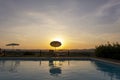 Outdoors sunset swimmingpool. Tropical resort hotel Royalty Free Stock Photo