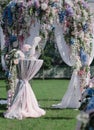 Outdoors wedding decoration with acacia garlands