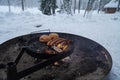 Outdoors winter barbecue with sausages Royalty Free Stock Photo