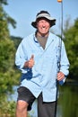 Outdoorsman With Thumbs Up With Fishing Rod Fishing