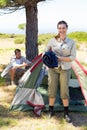 Outdoorsy couple setting up camp in the countryside Royalty Free Stock Photo