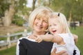 Outdoorsy Grandmother and Granddaughter Playing At The Park Royalty Free Stock Photo