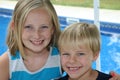 Outdor image of a young boy and girl by the swimmi Royalty Free Stock Photo