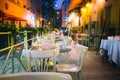 Restaurant terrace at night old European city street Royalty Free Stock Photo