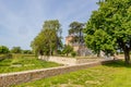 Outer garden of Borgharen castle against blue sky, surrounded by a dry moat Royalty Free Stock Photo