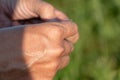 the outer side of the male palm. Muscles and veins of the arm close-up. Sweaty hand after a workout Royalty Free Stock Photo