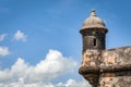 The outer tower and wall with sentry box of San Felipe del Morro fort in old San Juan in Puerto Rico, USA against the blue sky Royalty Free Stock Photo