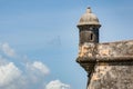 The outer tower and wall with sentry box of San Felipe del Morro fort in old San Juan in Puerto Rico, USA against the blue sky Royalty Free Stock Photo