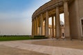 Outer view of one of the colonnades of the Basilica of Our Lady of Peace with the setting sun to the west Royalty Free Stock Photo