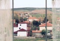 The outer view from the window and curtain openings, the view out the window