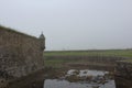 The outer wall of the fortress of Louisbourg, Cape Breton Island, on a foggy day