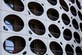 Outer wall modern building. Balconies with holes porthole. Royalty Free Stock Photo