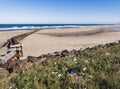 Waste pipe into the North Sea at Cambois, Northumberland, UK with litter in foreground Royalty Free Stock Photo