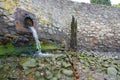 Outfall pipe emptying into harbour Royalty Free Stock Photo