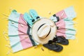 Outfit for beach and tropical vacations, straw beach sunhat,towel, sun glasses on yellow. Summer vacations concept Royalty Free Stock Photo