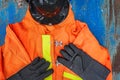 Outfit of Firefighter placed on old table background.