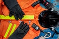 Outfit of Firefighter placed on old table background.