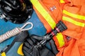 Outfit of Firefighter placed on old table background.