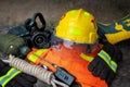 Outfit of Firefighter placed on wooden table background.