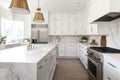 outfit modern white kitchen with marble countertops and stainless steel appliances Royalty Free Stock Photo