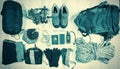 Outfit of traveler, climber, student, teenager. Overhead of essentials for modern sport young person. Different objects on wooden