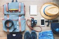 Outfit of young man traveler, camera, mobile device, sunglasses. Overhead shot of essentials for traveler Royalty Free Stock Photo