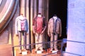 Outfits of Harry, Hermoine and Ron displayed at Warner Bros. Studio tour, London, UK