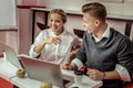 Outgoing co-workers being in great mood at work while laughing