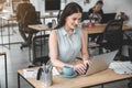 Outgoing lady using notebook computer