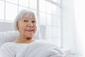 Outgoing pensioner reclining in comfortable cot