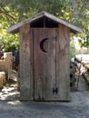 Outhouse with crescent moon door