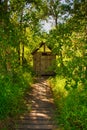 An Outhouse in a Forest Royalty Free Stock Photo