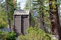 Outhouse toilet in forest