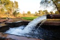 Outlet of a tube well to a temporary reservoir in a small village of Pakistan Royalty Free Stock Photo