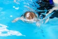 The outline of a child floating under water