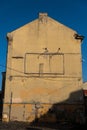 An outline of an empty billboard on the wall of an old building Royalty Free Stock Photo